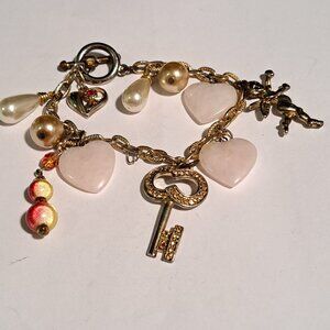 Perfect for St Valentines day. heart, key, cherub charm bracelet
